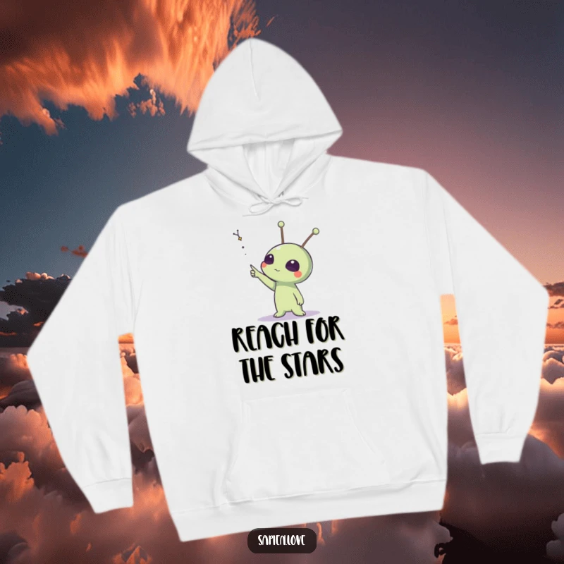 Funny hoodie featuring an alien creature with animated antennae pointing resolutely towards a distant, glittering star cluster.