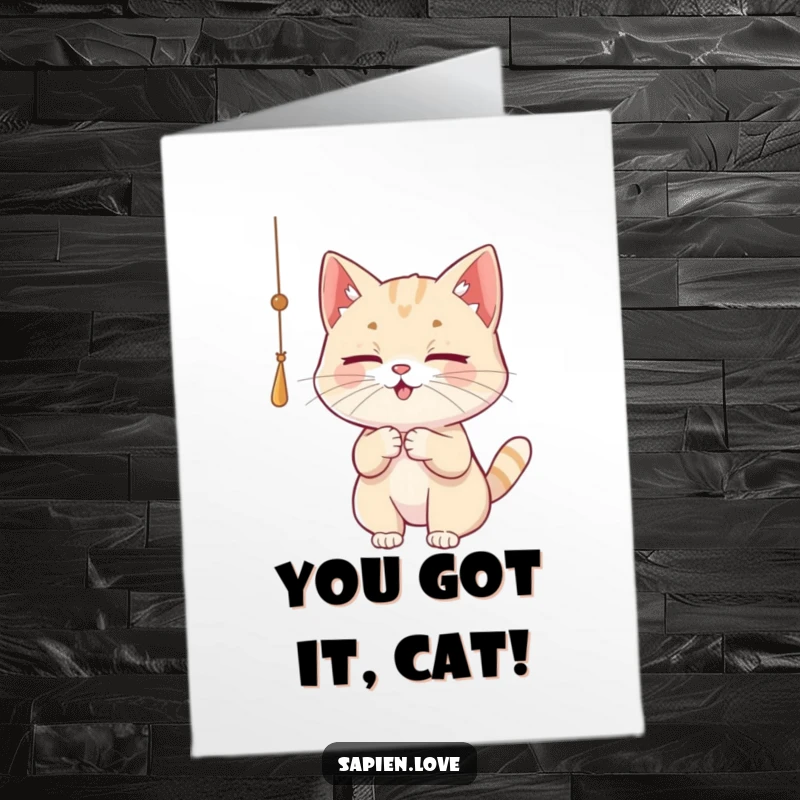 Free printable congratulations card with a focused cat character batting at a dangling string, symbolizing playful achievement.